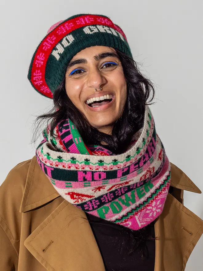 Model is wearing our fairisle loop scarf and tam in bubblegum and kelly green 