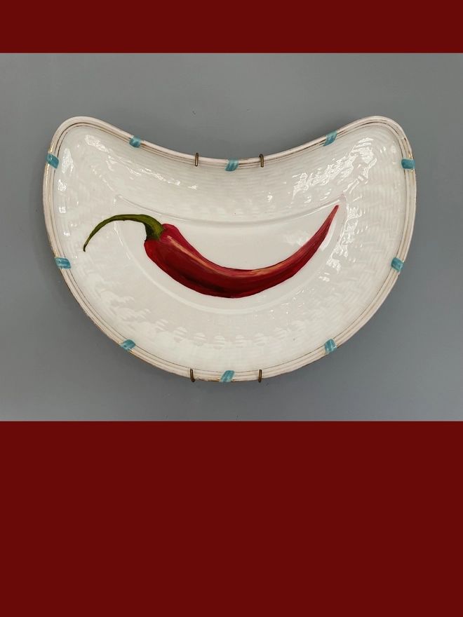 red chilli oil painting on plate
