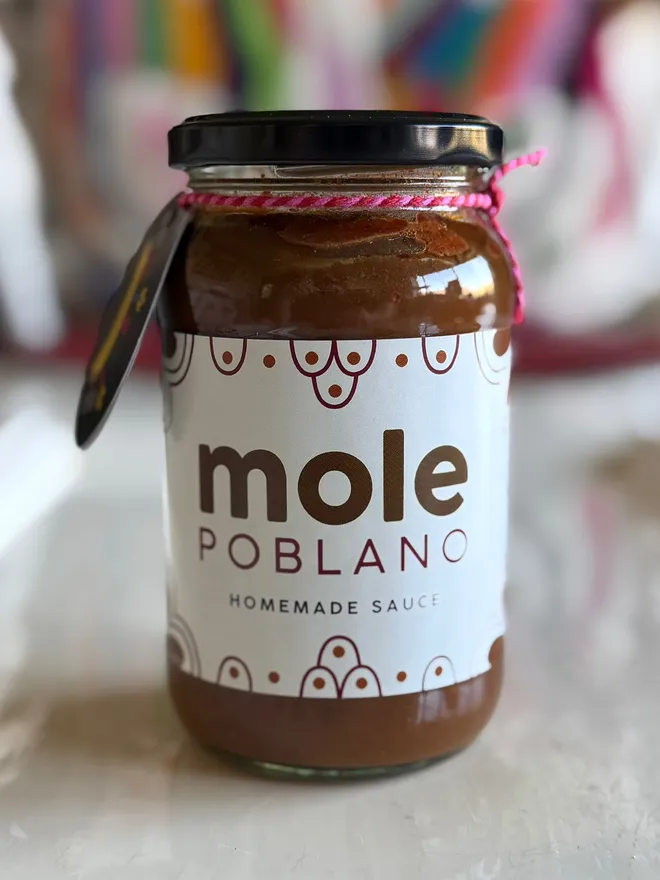 'Mole Poblano' Sauce Jar (Set Of 1-4 Jars), a jar of sauce sitting on a kitchen counter top. 