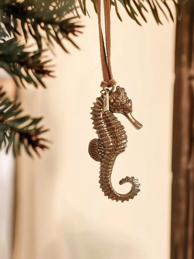 Seahorse Christmas Hanging Decoration hanging from festive branch