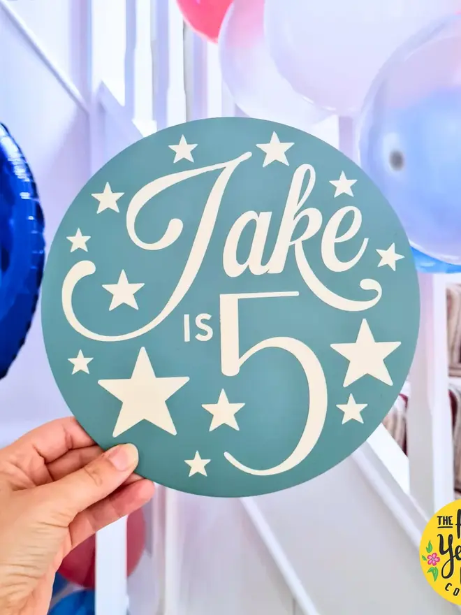 personalised wooden birthday sign. a blue round wooden sign with a personalised birthday message.