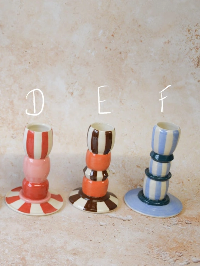 Handmade striped ceramic candlestick holders - pink, orange, brown and blue colour options labelled D, E, F