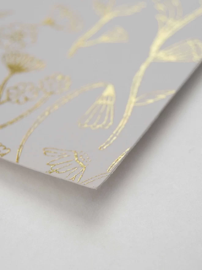  Gold Flower Hot foiled card design. Close up. Whimsical design