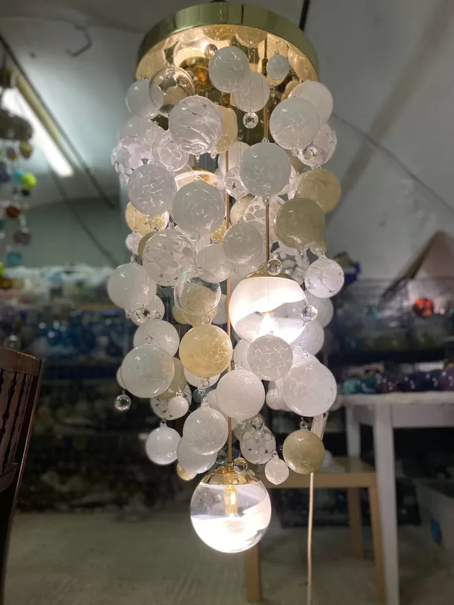 Blown glass chandelier illuminated