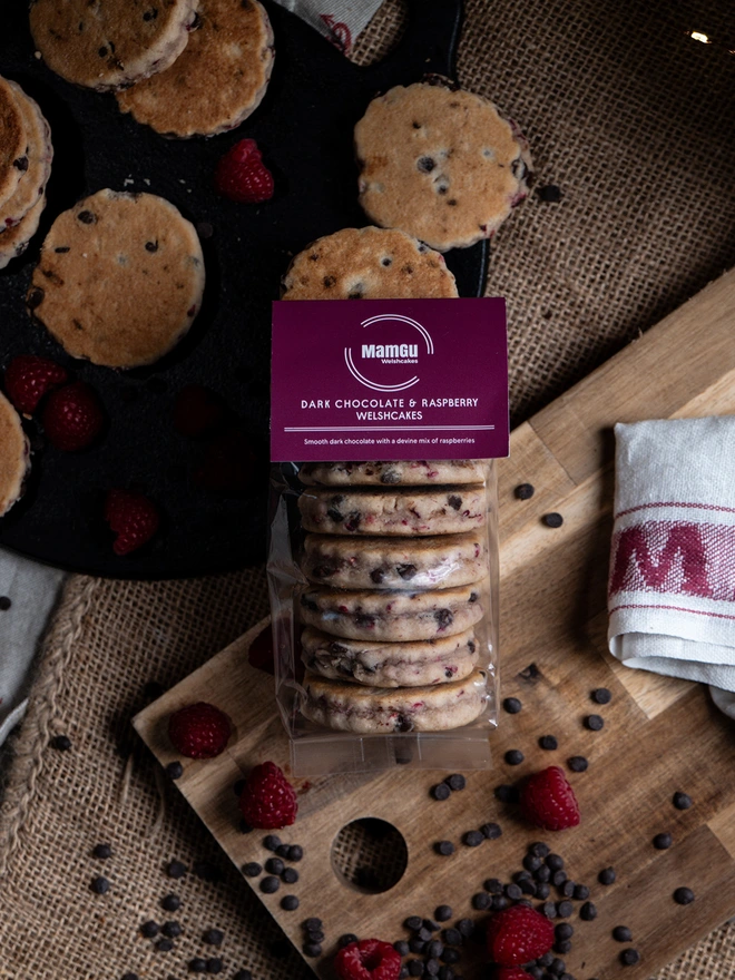 Dark Chocolate & Raspberry on a griddle and wooden board with loose ingredients 