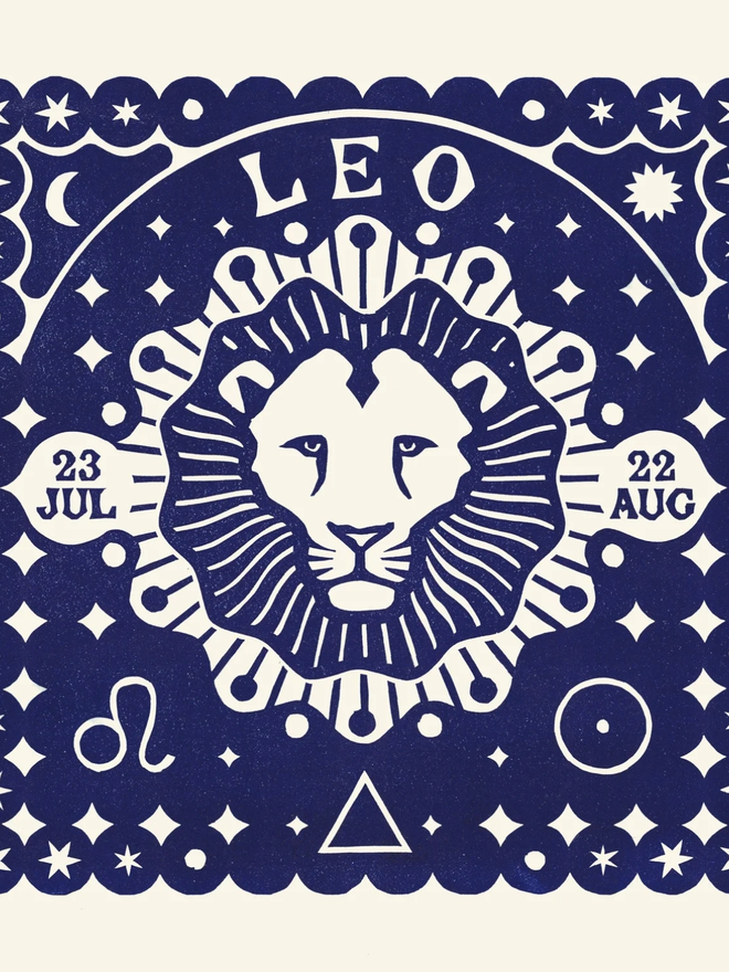 leo zodiac lino cut. a linocut lion and zodiac symbols printed on a blue background.