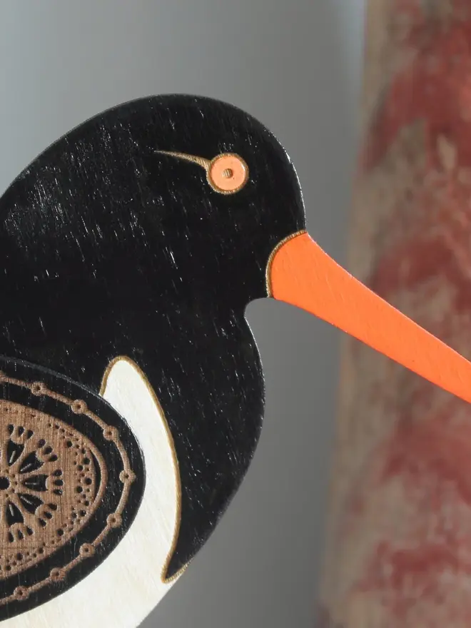 Standing Wooden Oyster Catcher, wooden bird decoration standing on a platform. 