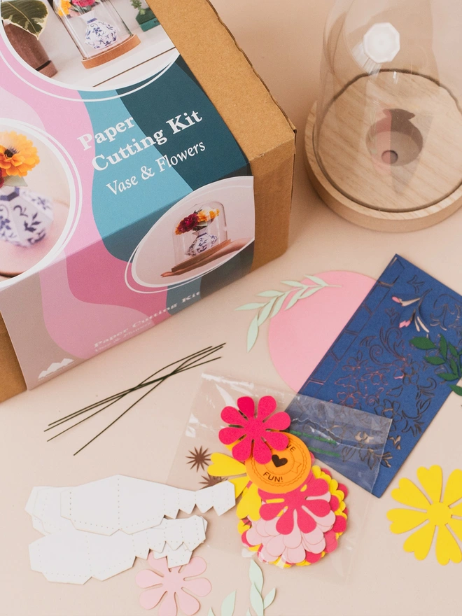 the flower and vase packaging and the pieces of the paper craft kit by My Papercut Forest 