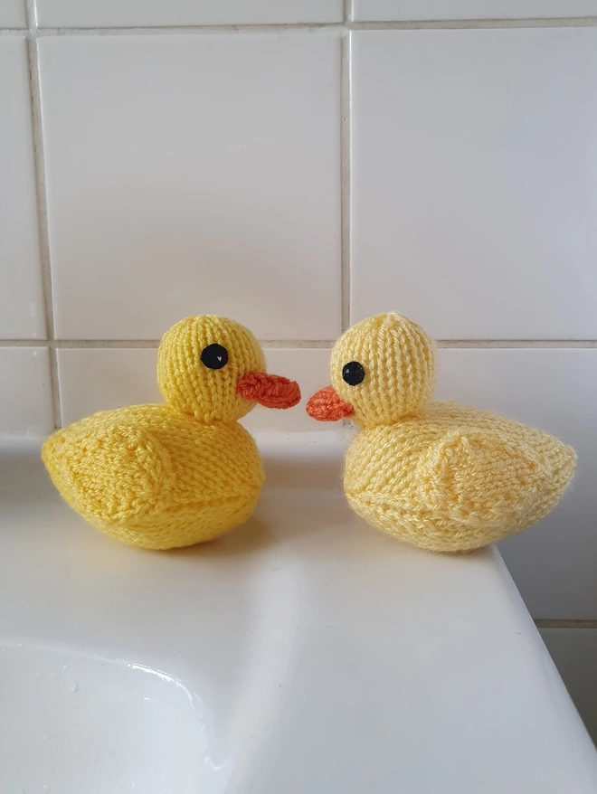knitted rubber ducks in the bathroom