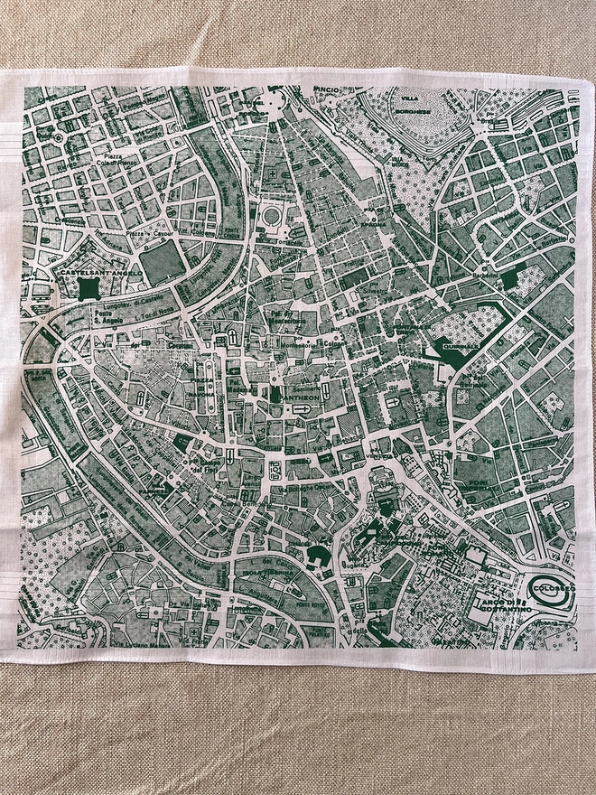 A Mr.PS Rome map hankie laid flat on a tablecloth