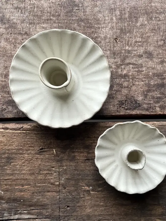 Handmade White Ceramic Candlestick Holder, a pair of white candle holders sitting on a wooden surface. 