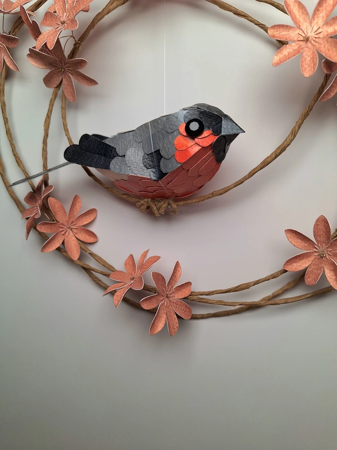 close up of a handmade bullfinch bird sculpture