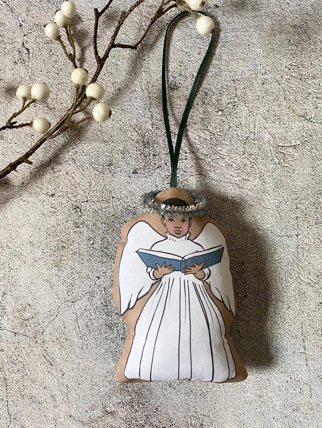 a little Afro Caribbean boy angel Christmas tree decoration