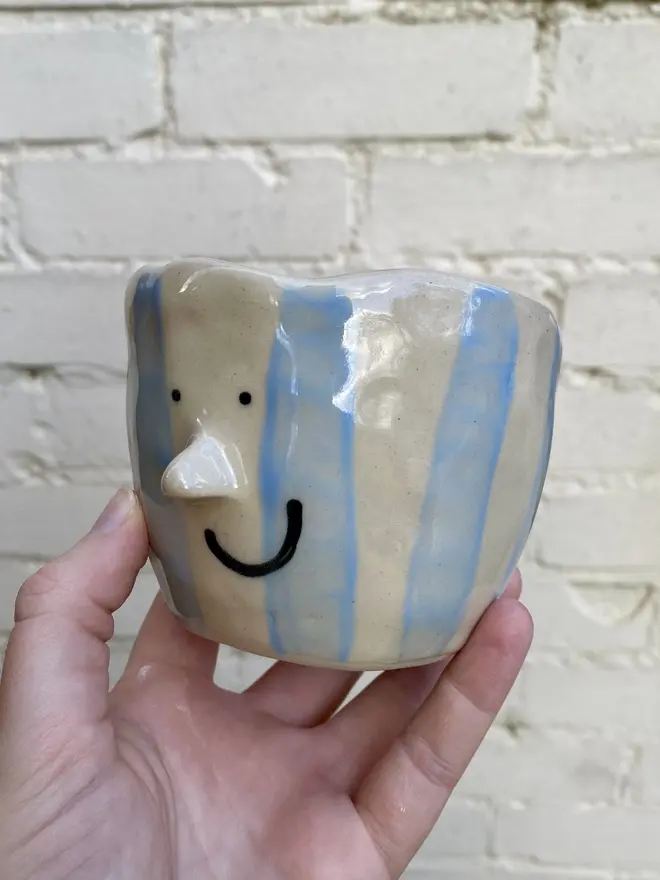 blue white stripe handmade ceramic smiley face pot