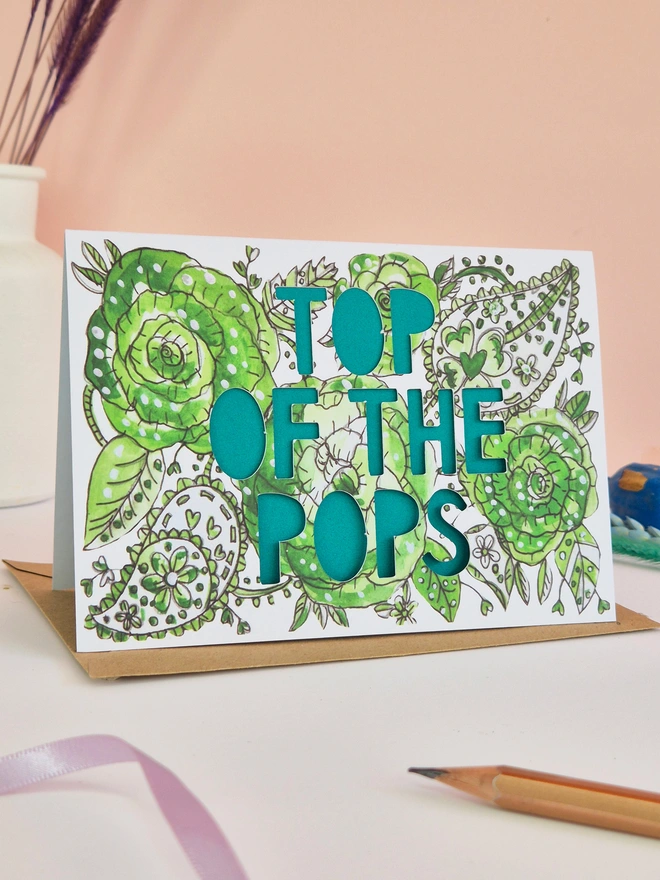 green paisley illustration print greeting card with Top of the Pops Paper cut text and green paper liner 