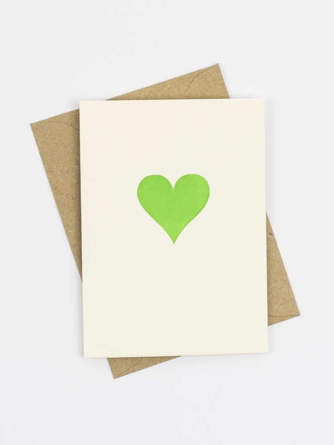 Neon green heart in the middle of a little note with envelope, two of each colour are included in out lovely gift box