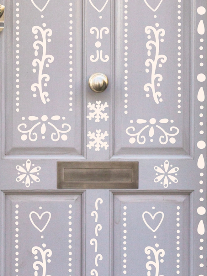 Close up Gingerbred House Door Sticker Decal Set on a lilac door