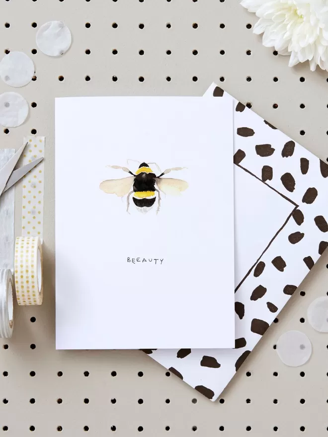 Liz Temperley Blank Inside watercolour illustration of a bee on a card with a black and white envelope.