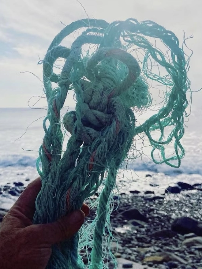 Small Green Ocean Plastic Plant Pot, the recycled rope from which the plant pot was made. 