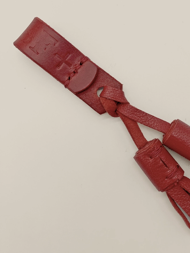 close up of dog leather tassels accessory