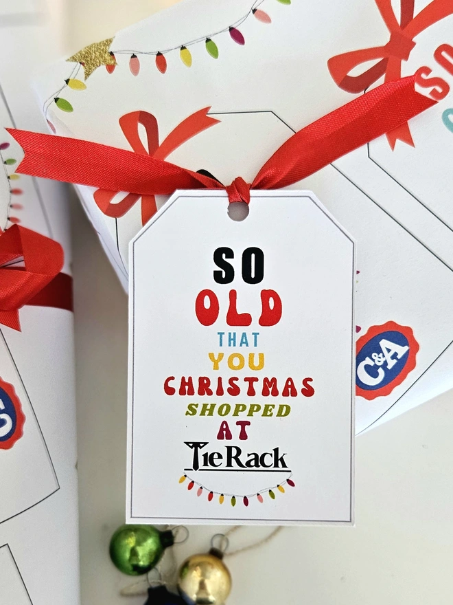 A gift tag on the present thats says so old that you Christmas shopped at Tie Rack to match the paper.