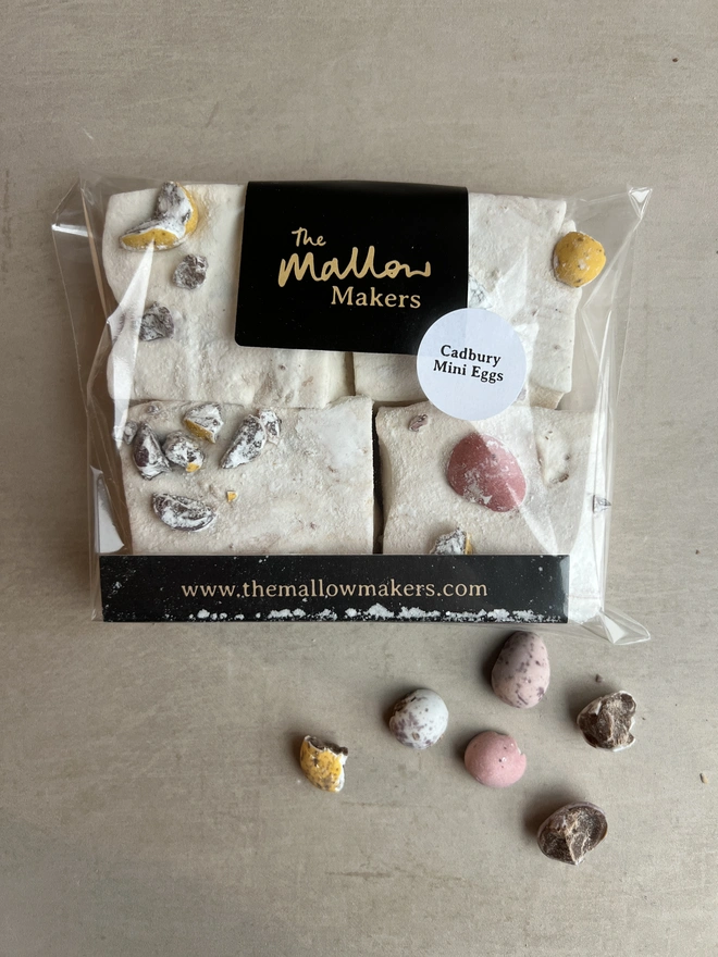 Mini Eggs Jumbo Marshmallows four pack decorated with mini eggs and with crushed mini eggs scattered around
