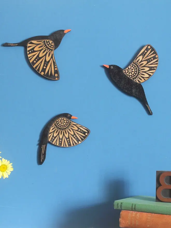 Folk Art Wooden Blackbirds (Set Of 3), group of blackbirds flying hanging on a wall. 