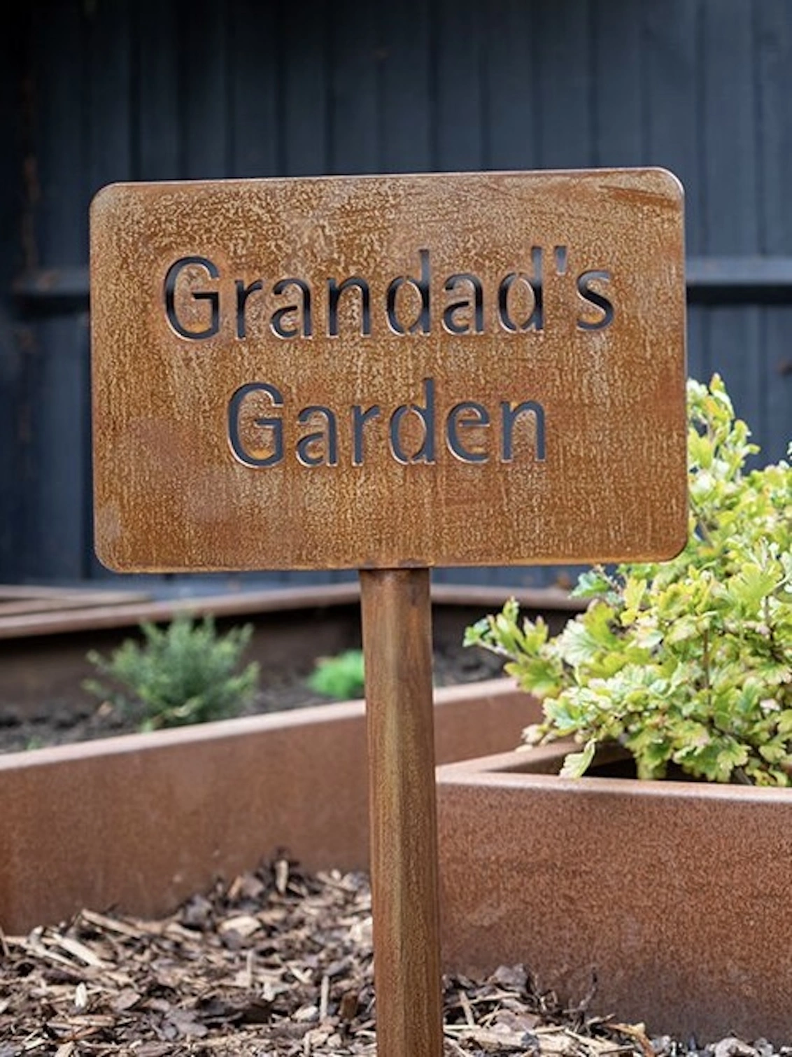 Personalised Garden Sign, in ground with stake saying: 'Grandad's Garden'.