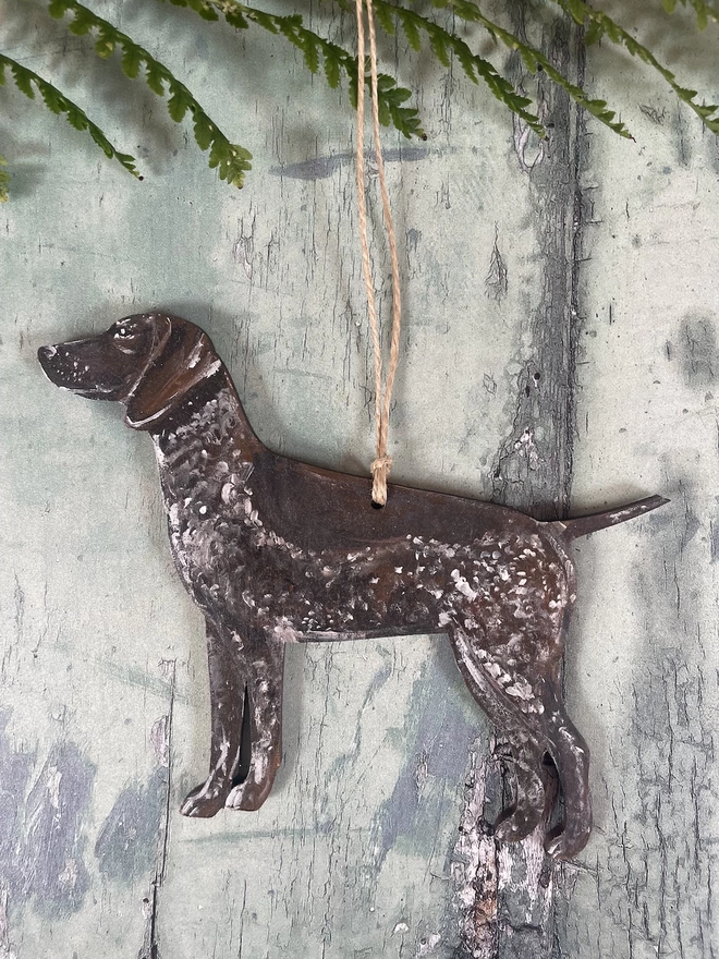 A dog breed decoration with natural jute twine