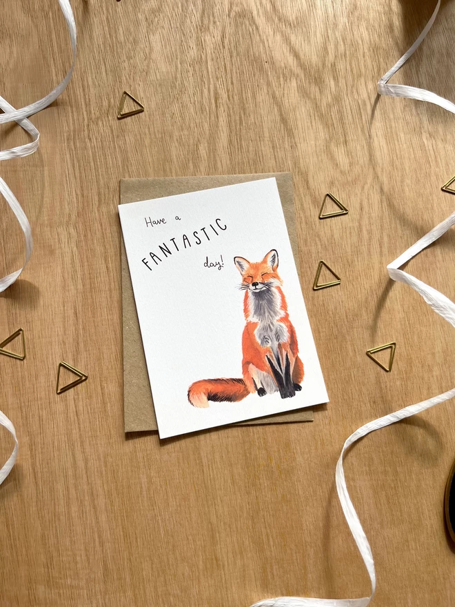 Greetings card with a happy looking red fox and the phrase ‘have a fantastic day”