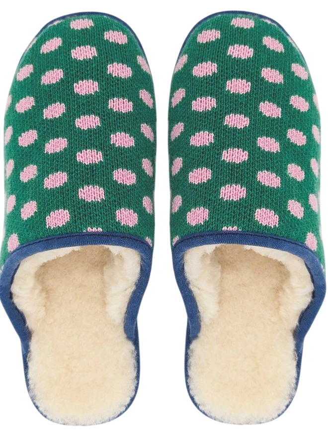 Lambswool & Sheepskin Slippers, a pair of colourful lambswool and sheepskin slippers sitting on a plain white surface. 
