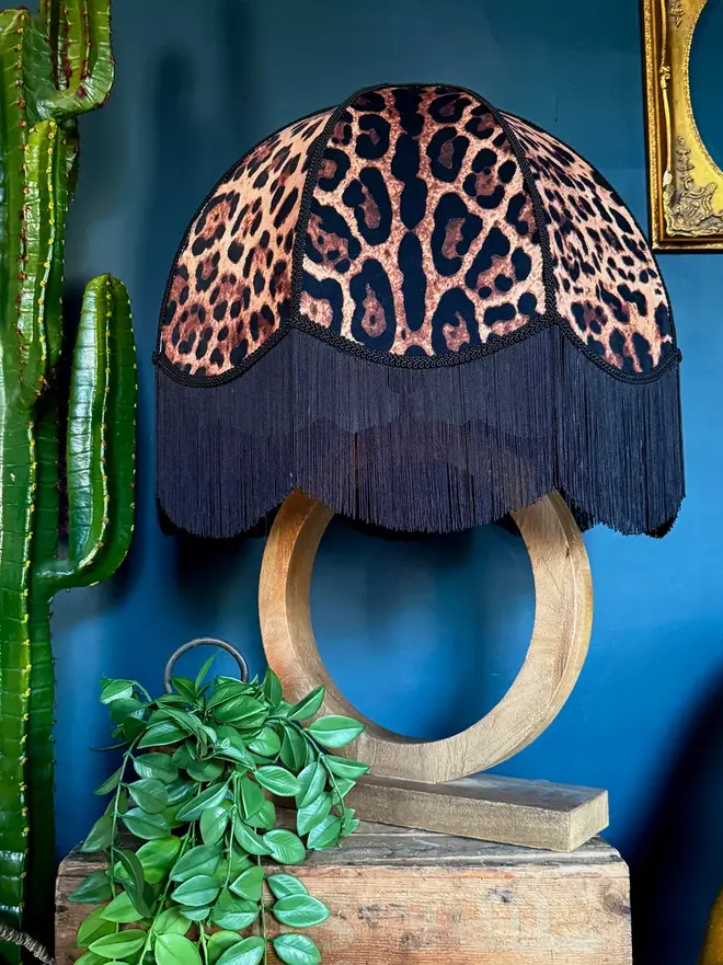 Vintage Fringed Dome Lampshade In Leopardess, in a room. 