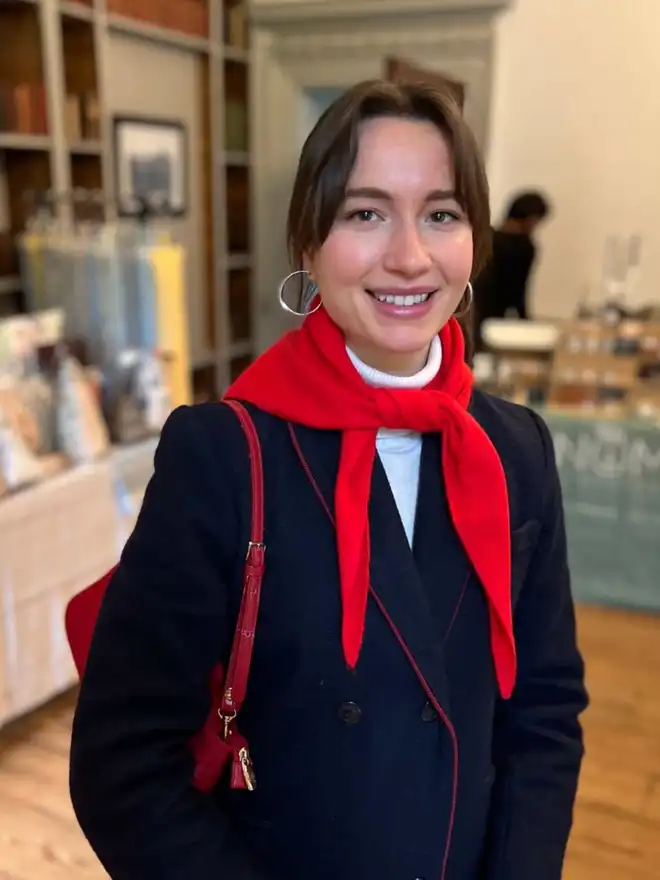 merino red triangle scarf worn around models neck