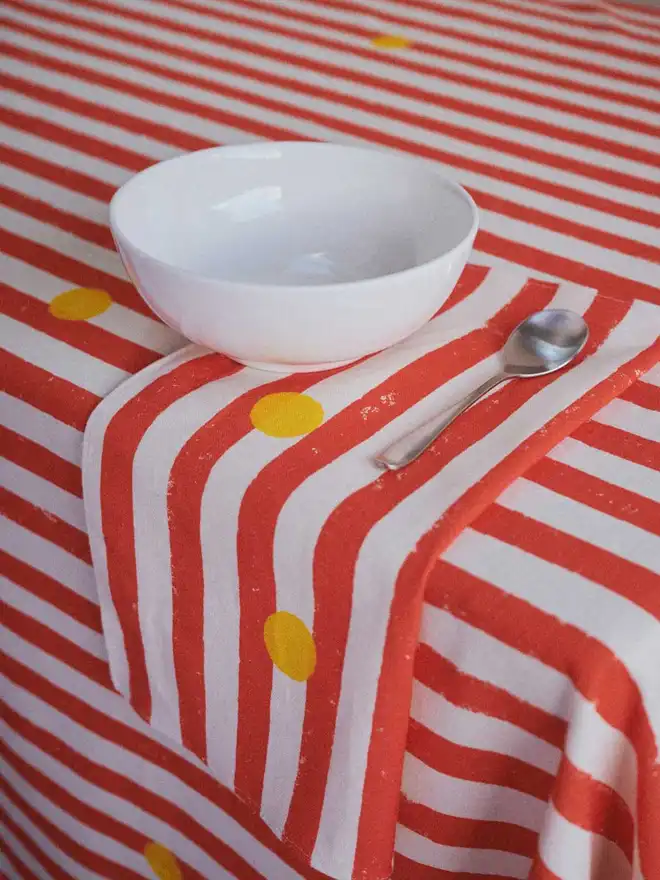 Red stripe yellow dot napkins and tablecloth