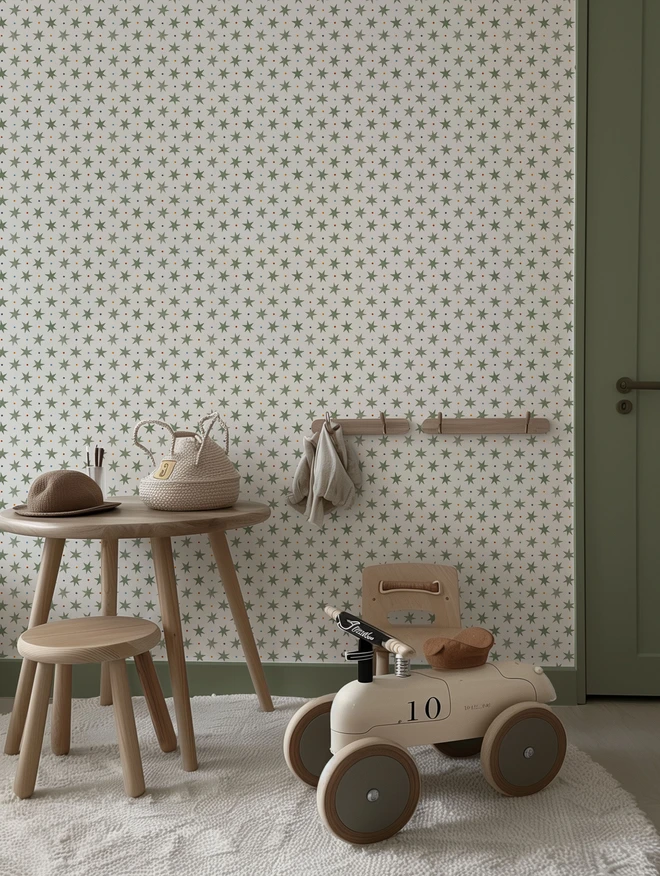 Ducks In A Row Stars and Spots Wallpaper Puddle Green colour way in boys nursery with scant decor and retro car
