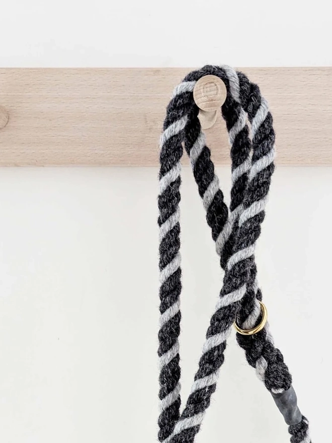 Wool Twist Dog Lead, a wool dog lead hanging on a wooden peg. 