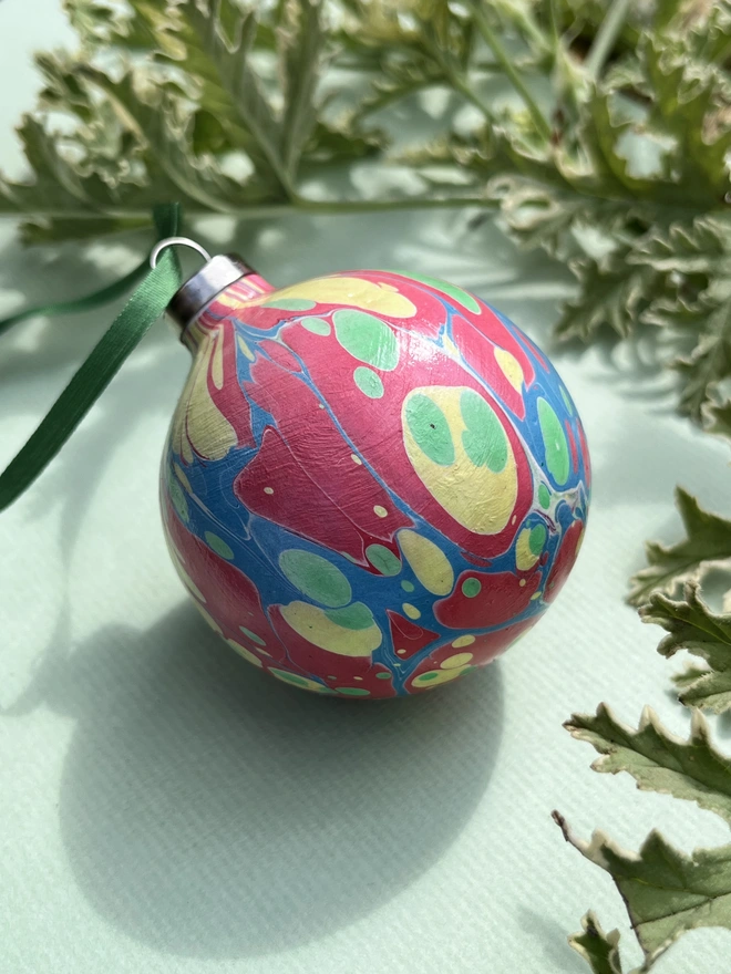 Hand-marbled round ceramic Christmas bauble