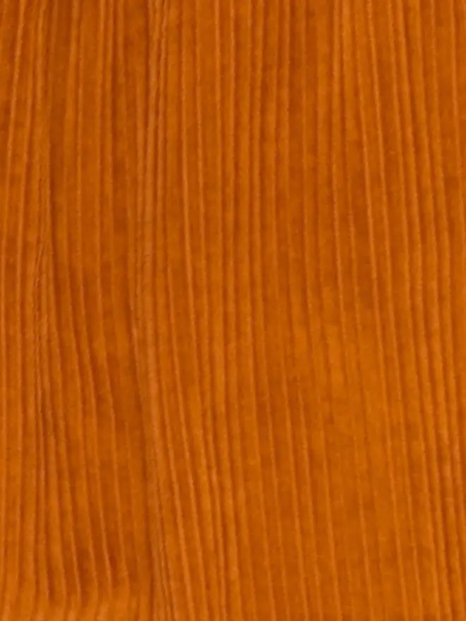 Close-up of Studio Koter's umber cotton corduroy, a wide-wale weave.