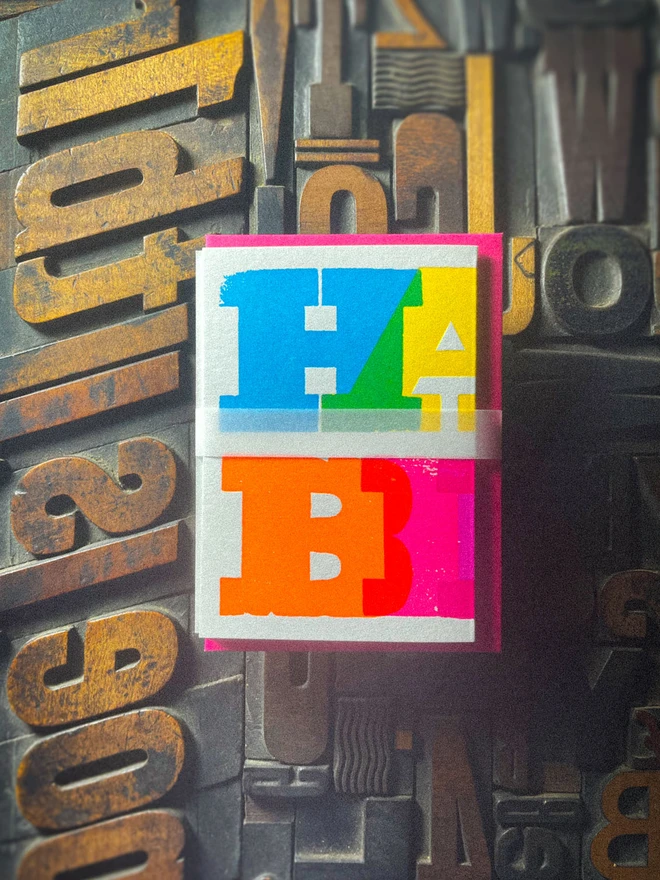 Handmade letterpress concertina birthday card featuring bold, joyful typography in vibrant neon colours. Each card is individually hand printed using traditional letterpress techniques on luxury paper stock, creating a beautifully tactile finish with deep impression and rich ink coverage. The playful fold-out concertina design reveals a striking “Happy Birthday” message across multiple panels, making it both a greeting card and a keepsake.  Created by hand for Holly & Co , this contemporary artisan birthday card combines modern graphic design with traditional craftsmanship. Perfect for design lovers, colourful stationery enthusiasts, and anyone looking for a unique luxury birthday card with personality.