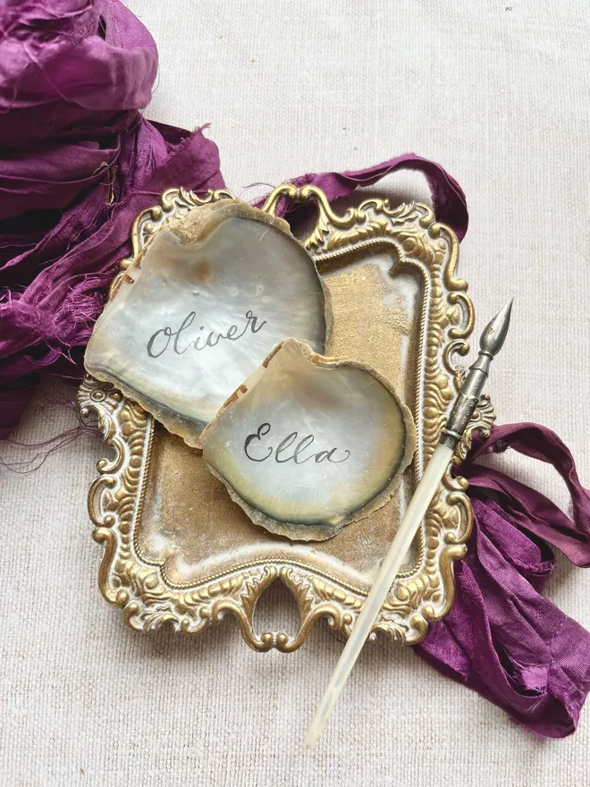 Handwritten oyster shell place cards