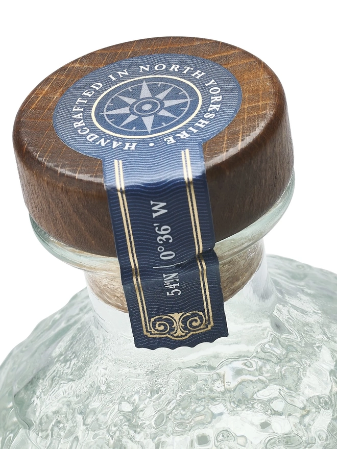 Original Edition Gin, a bottle of gin sitting on a plain white surface. 
