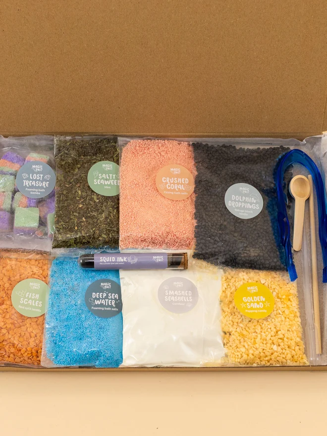 ocean potion children's sensory set. nine bags of various sensory materials packaged and placed in a cardboard box.