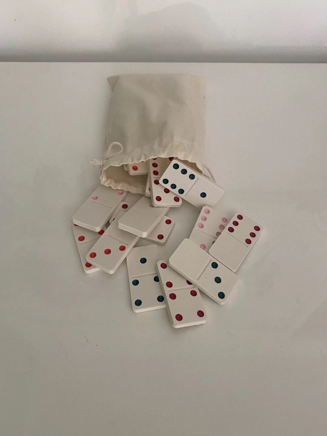 Handmade Valentines And Colourful Jesmonite Dominoes, a group of colourful dominoes on a white surface. 
