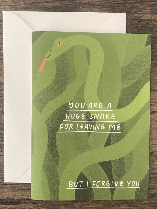 Greetings card of a snake, with the text 'You are a huge snake for leaving me, but I forgive you'