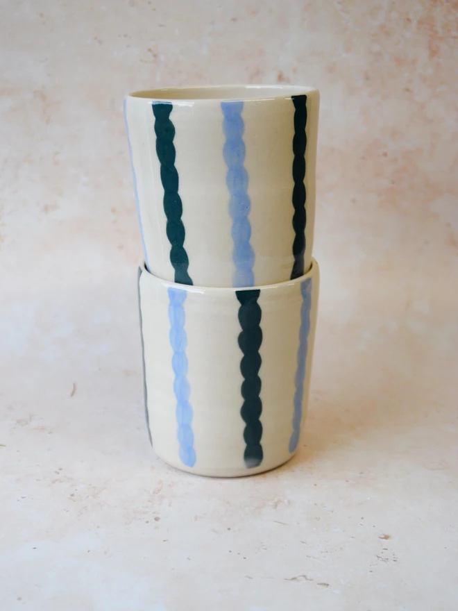 Handmade ceramic Stripe Pop tumblers - blue striped pair stacked together
