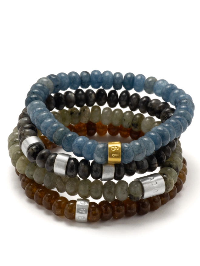 Strong, stylish and full of meaning. This stretch bead bracelet blends natural jade and labradorite with hand-stamped sterling silver life beads — a versatile piece designed for dads, partners, friends (and yes, the girls too).