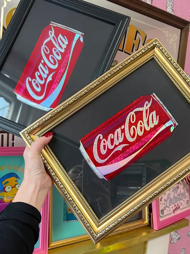 'Coca Cola' Can ScreenPrint, a person holding a colourful coca cola can print in a frame. 
