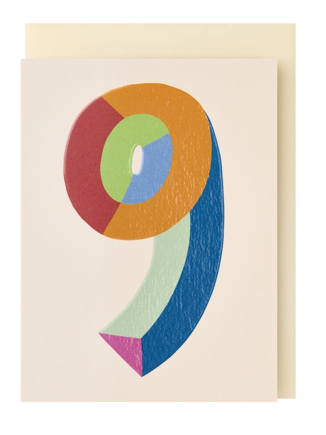 A colourful mini greeting card featuring a colour block 9 in the centre with a cream background