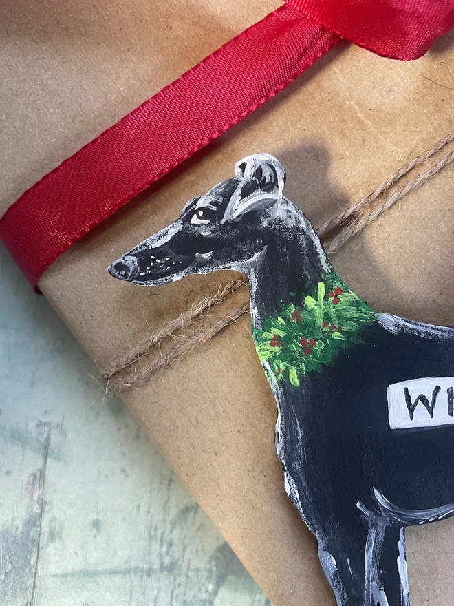 Close up of a black greyhound Christmas decoration personalised with the dog's name, Willow