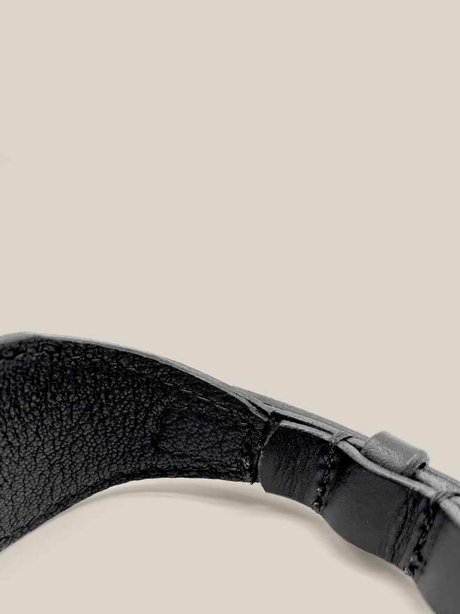 close up of stitching of black sighthound collar